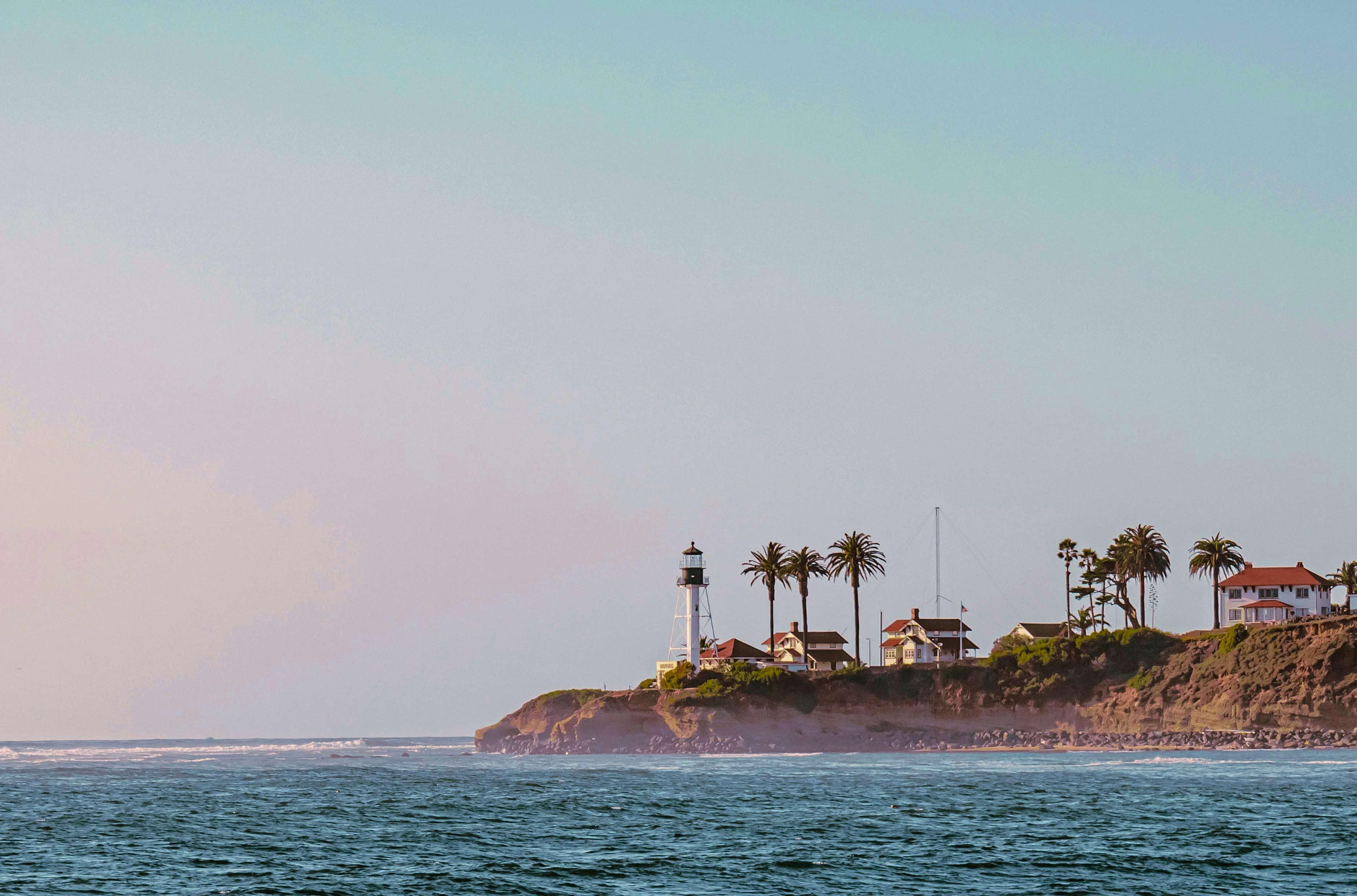 Coastal lighthouse and waterfront imagery from Seaport Funding Group’s website.